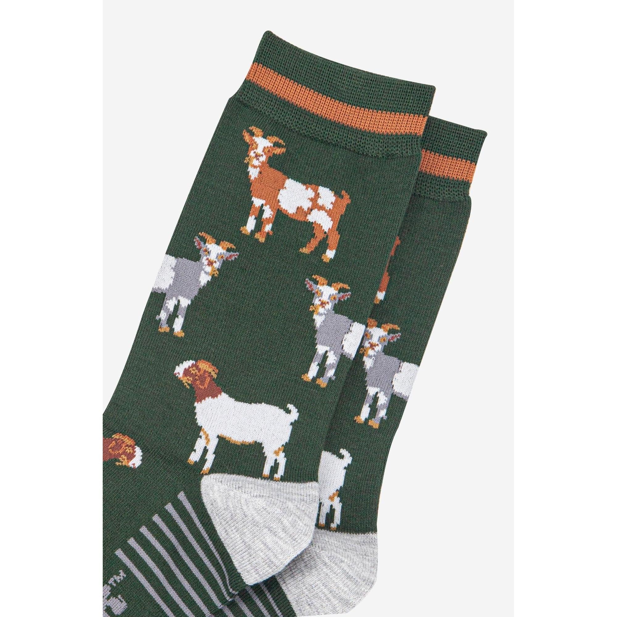 Sock Talk men's bamboo socks with khaki/tan goat pattern, green background, and gray heel and toe detail.