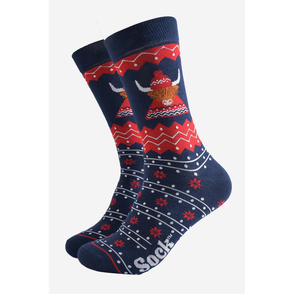 Mens bamboo socks with Highland cow hat and jumper design in red, navy, and white, featuring festive patterns and branding.