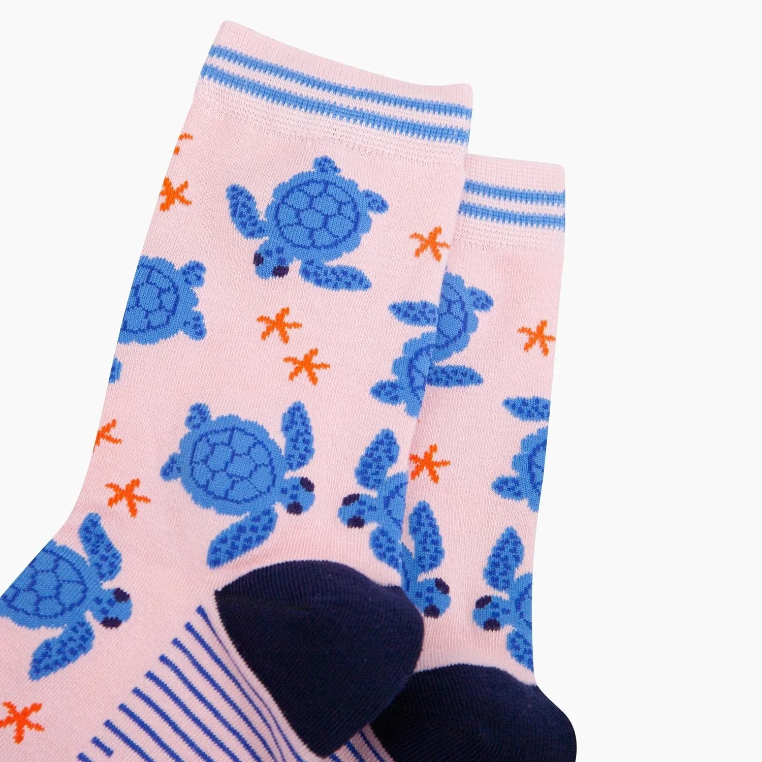 Sock Talk Sea Turtles pink bamboo socks with blue turtle and orange starfish pattern, reinforced toe and striped cuff.