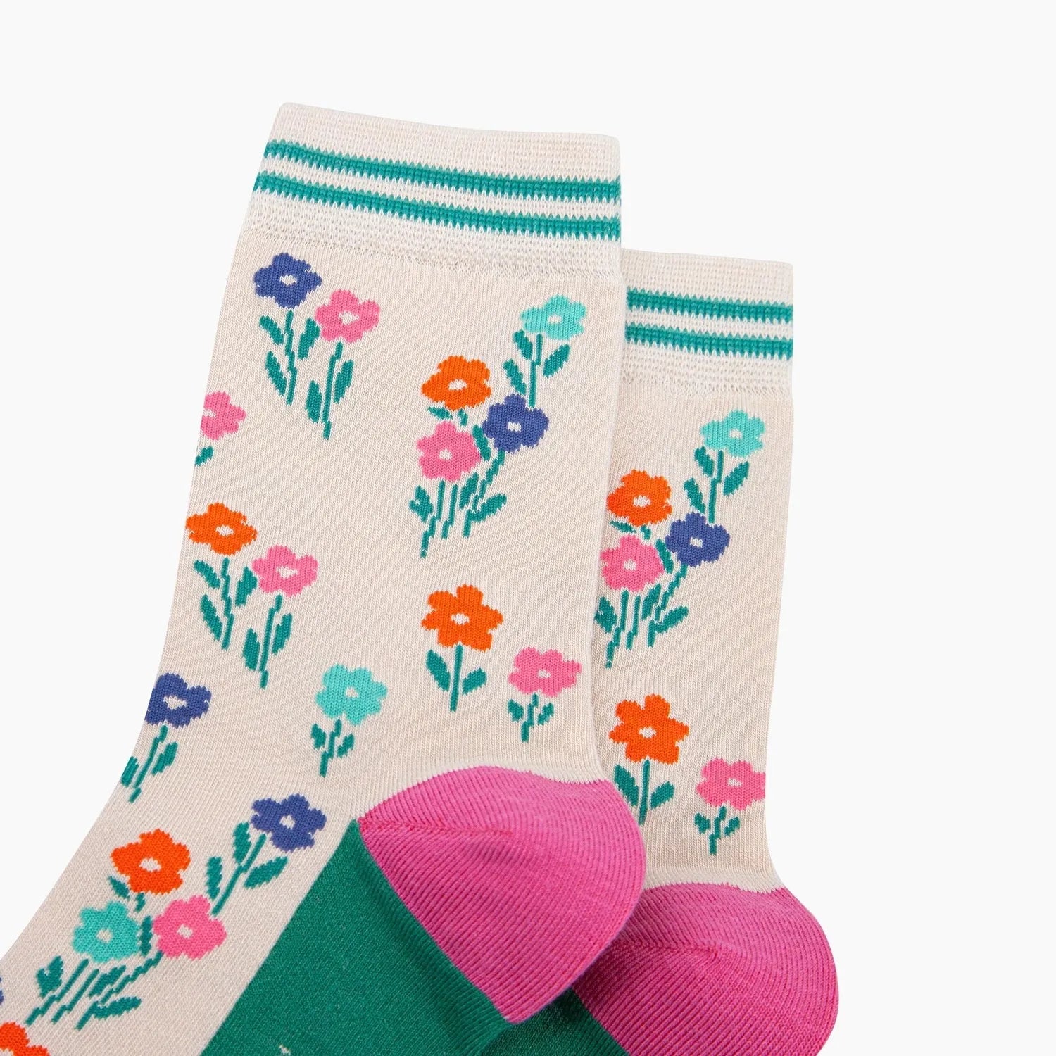 Sock Talk Wildflowers Bamboo Socks in Cream with colorful floral pattern, green toe, pink heel, and striped cuff.