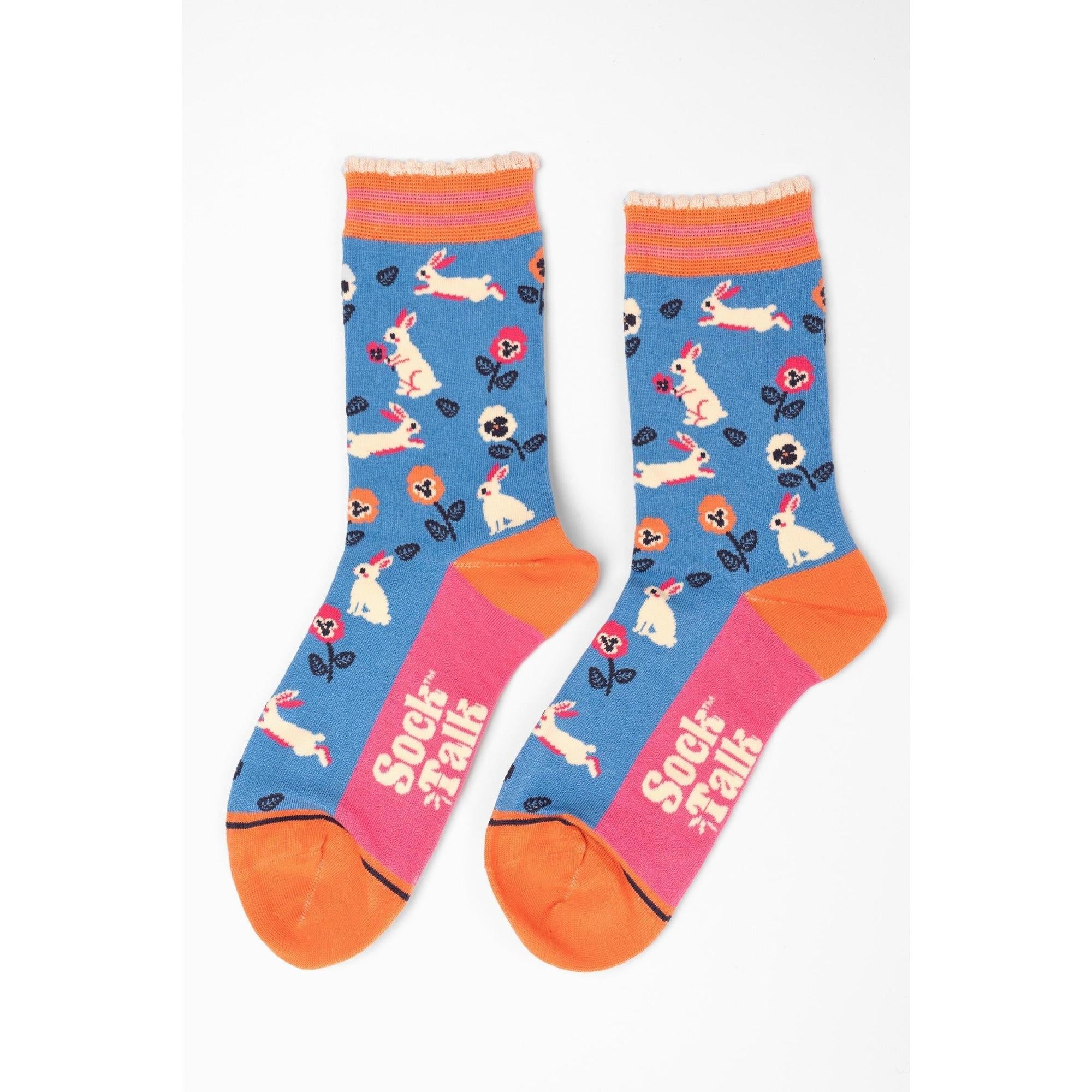 Women's blue bamboo socks with bunny and flower pattern, orange toes, and 
