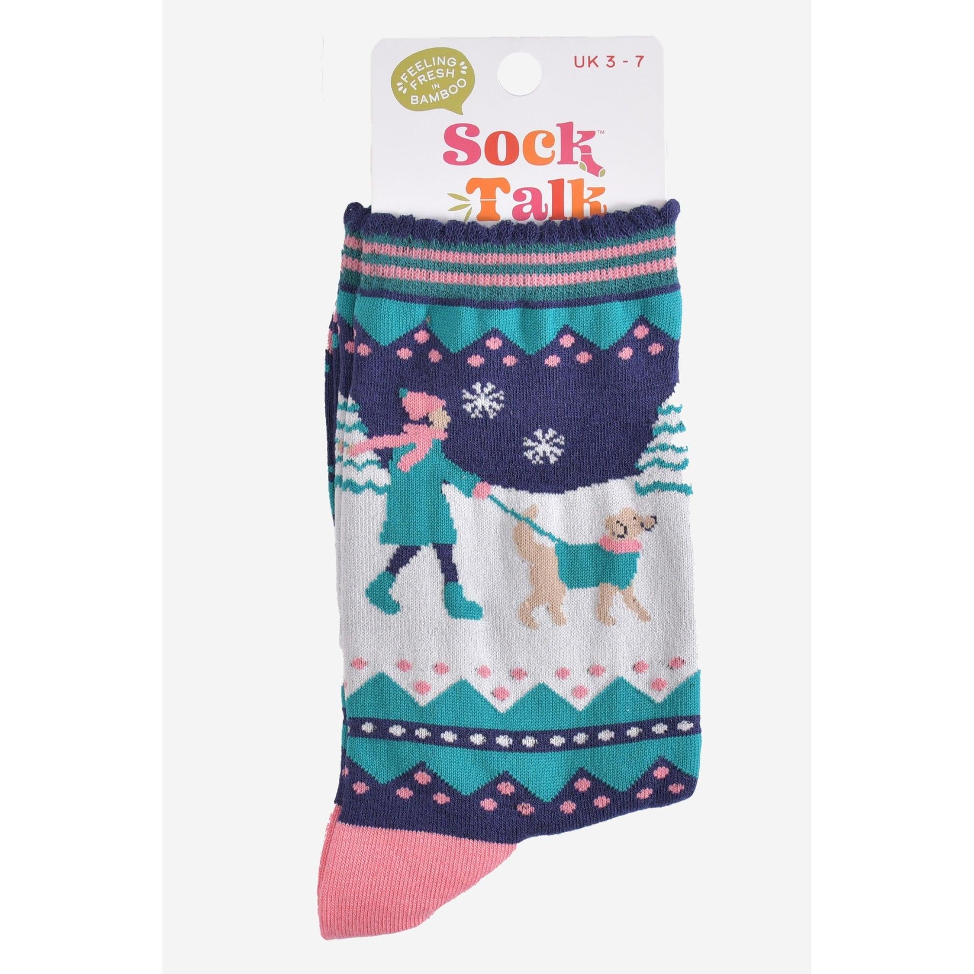 Women's bamboo sock featuring a navy blue and pink design with a golden retriever walking, snowflakes, and winter patterns.