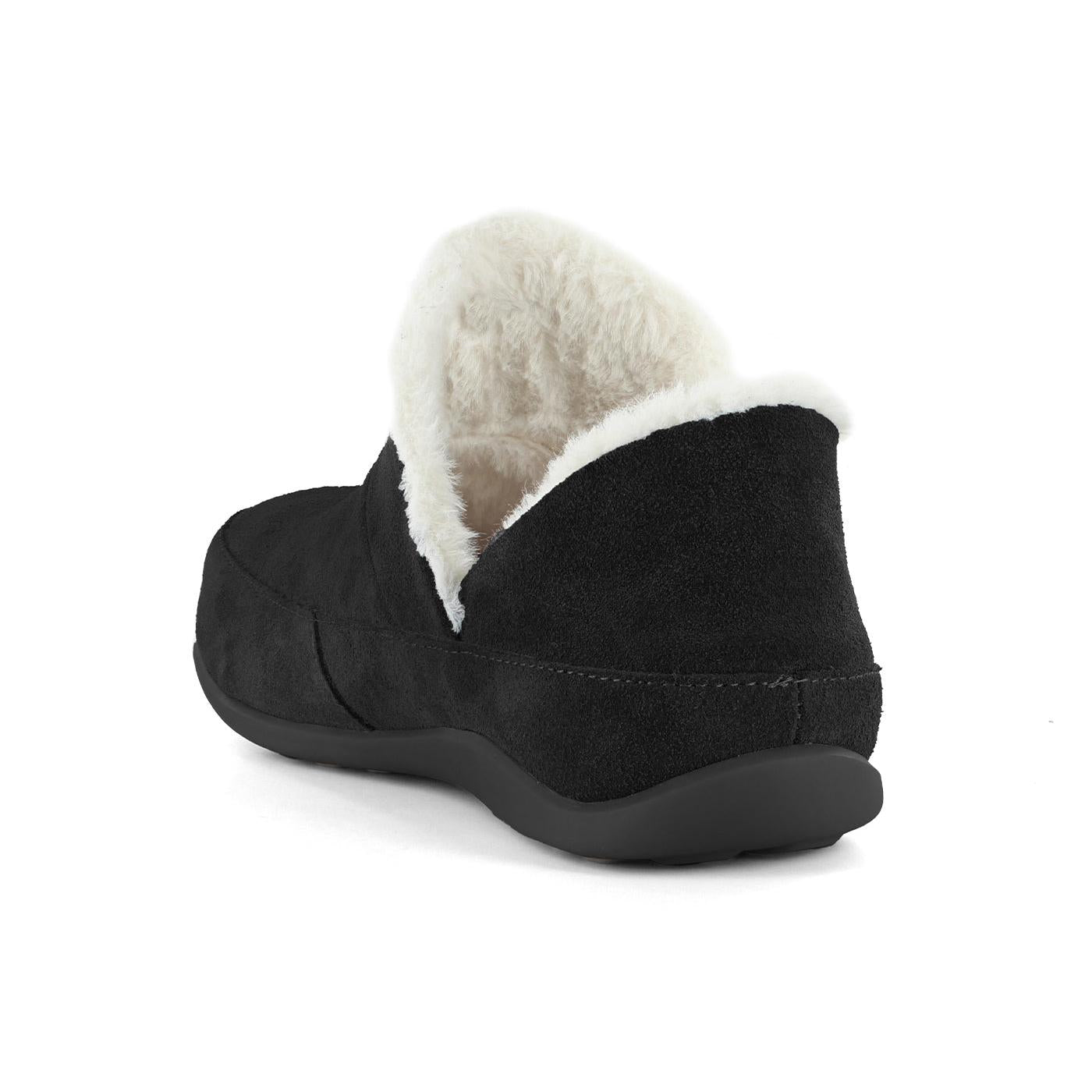 Strive Geneva ladies black leather slip-on slippers with arch support and plush faux fur lining.