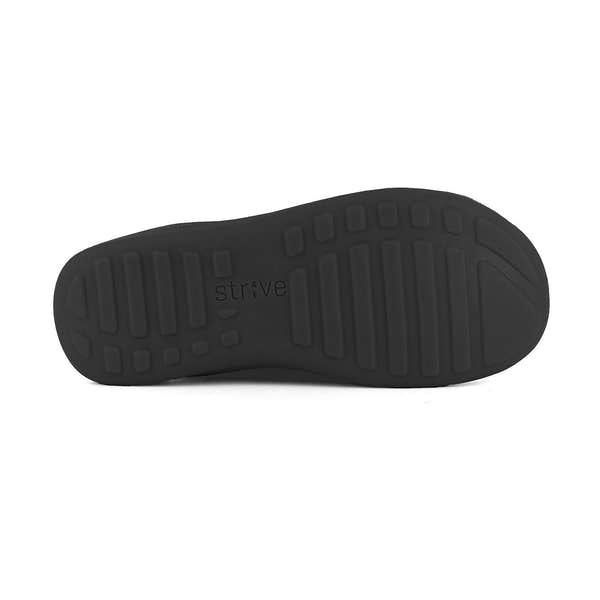 Strive Geneva women's black leather slip-on slippers with arch support and textured sole for comfort.