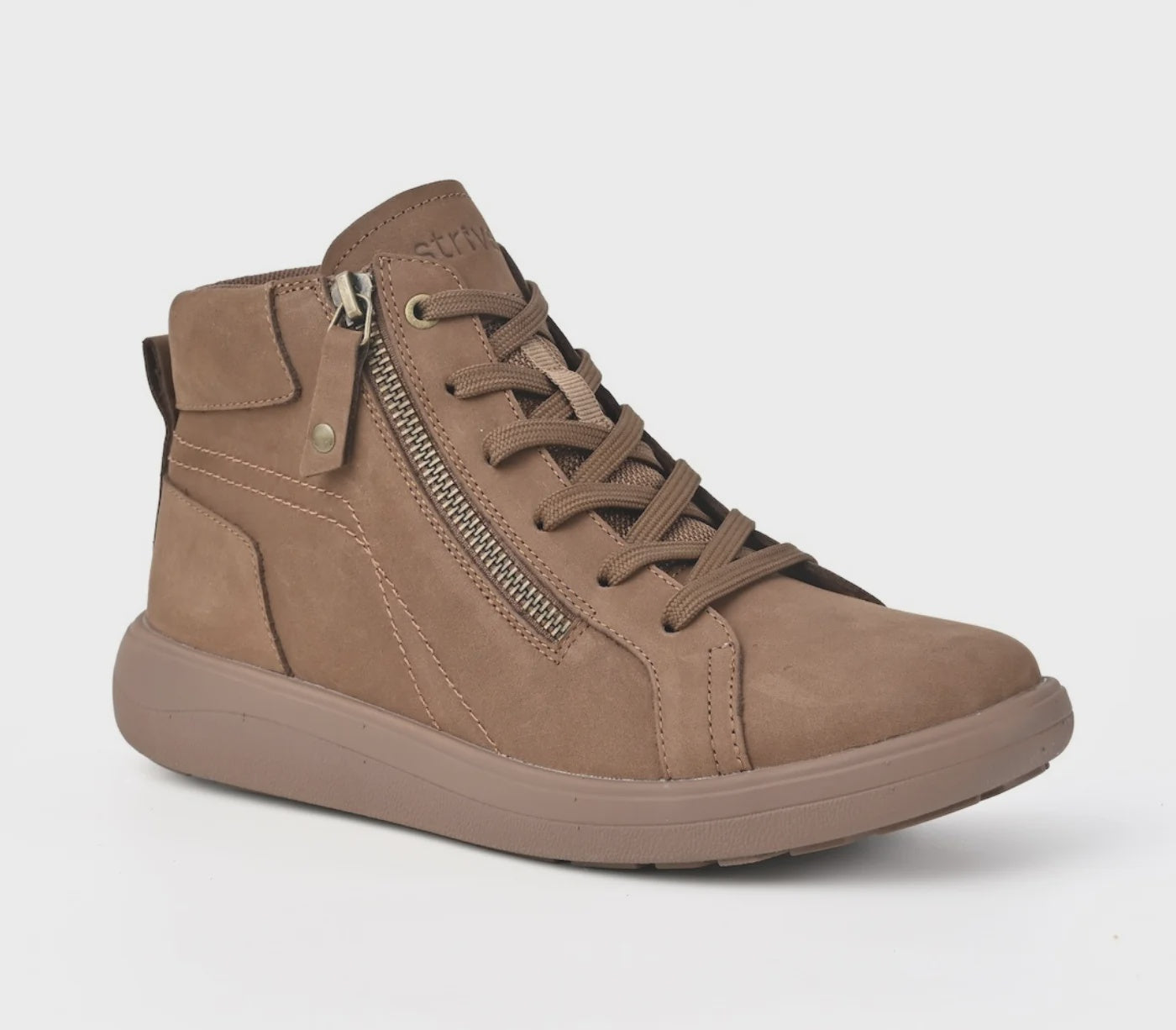 Strive Kensington tan ankle boot, three-quarter view showing the zip and laces