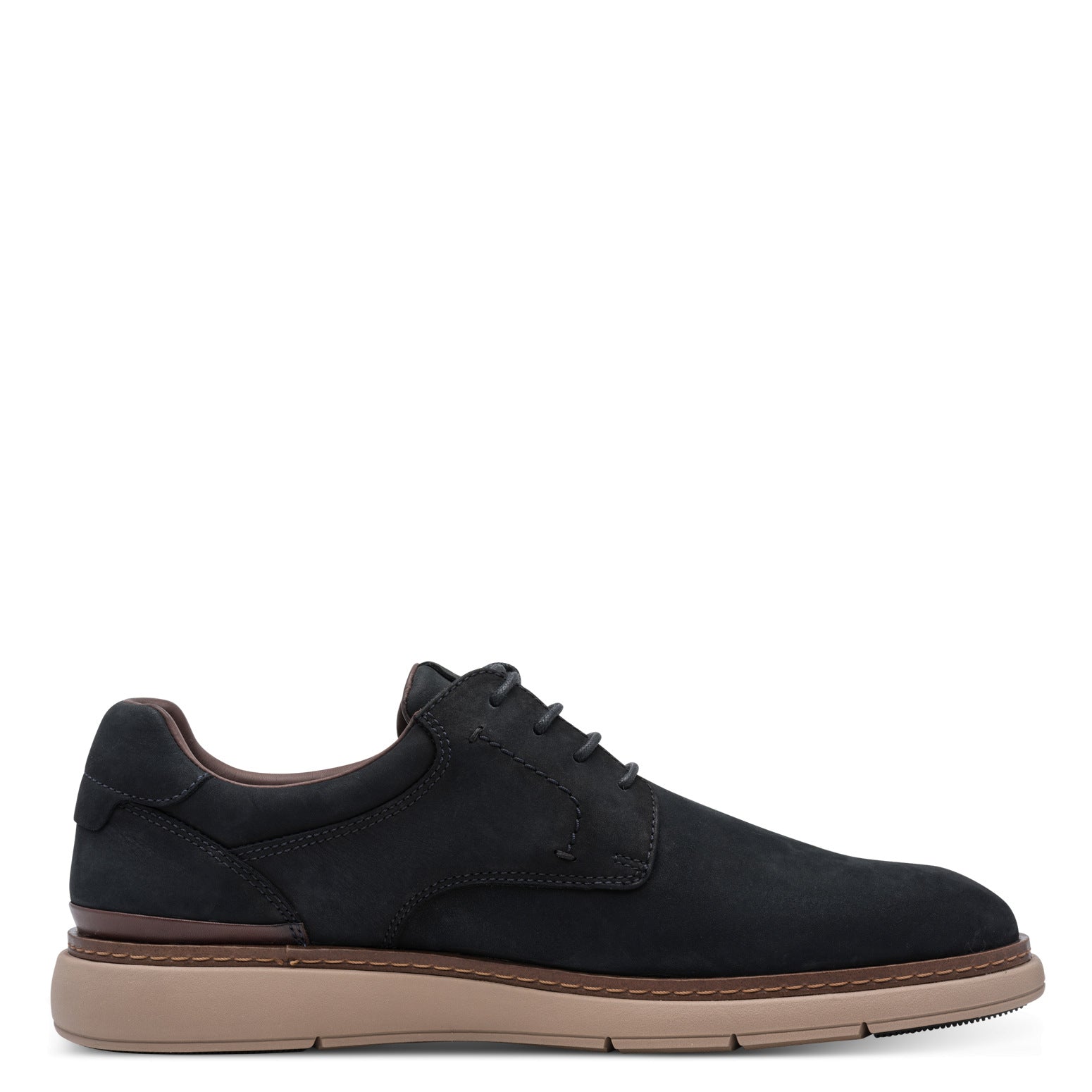 Inner side of the navy Tamaris lace-up shoe showing the lace fastening and low heel.