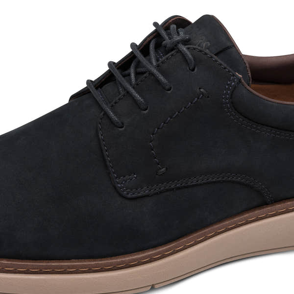 Close-up of the navy Tamaris lace-up shoe showing the leather texture, stitching and lace eyelets.