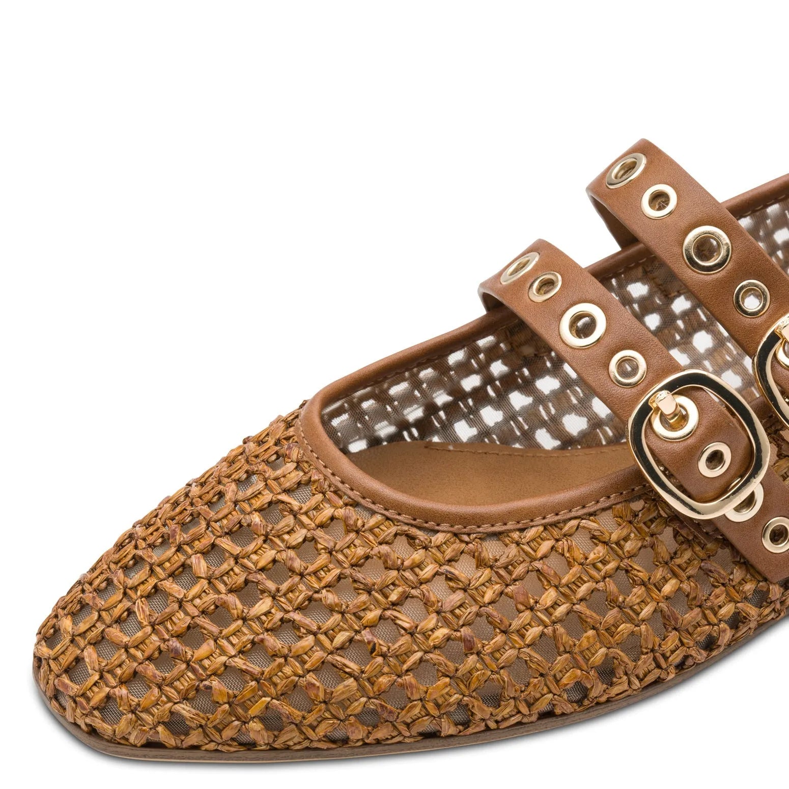 Women's brown woven textile flats with buckle straps and gold eyelet details.