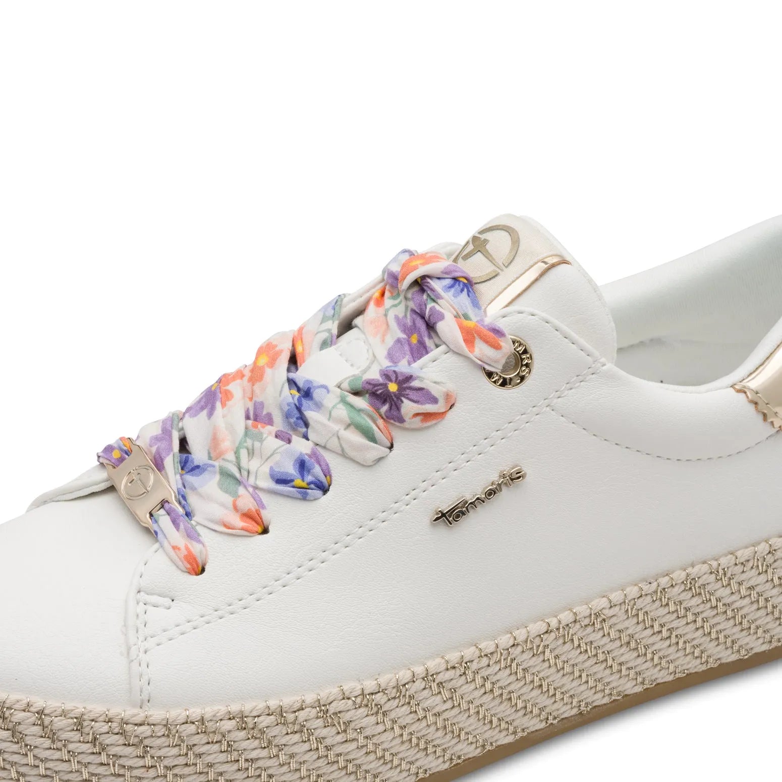 White lace-up sneaker with floral patterned laces, gold-tone accents, and a woven platform sole.