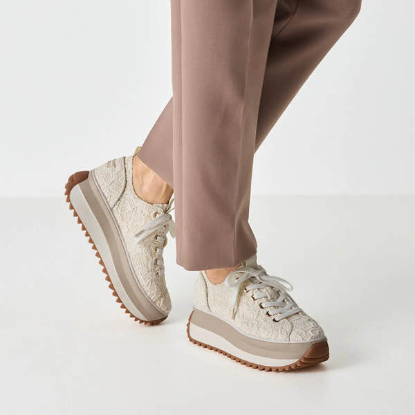 Women’s ivory textile lace-up shoes with a chunky platform sole and brown rugged outsole.
