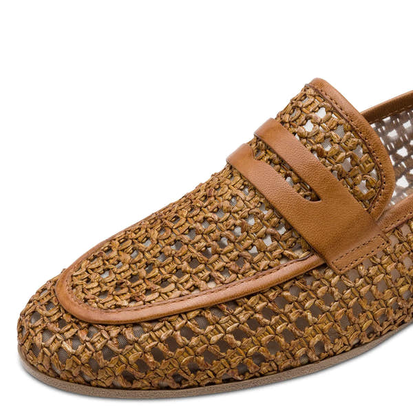 Tamaris cognac leather and textile slip-on shoes with woven design and leather strap detail.