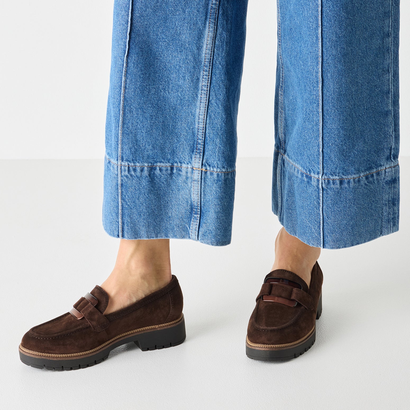 Mocca brown tamaris loafer worn on foot, side view.