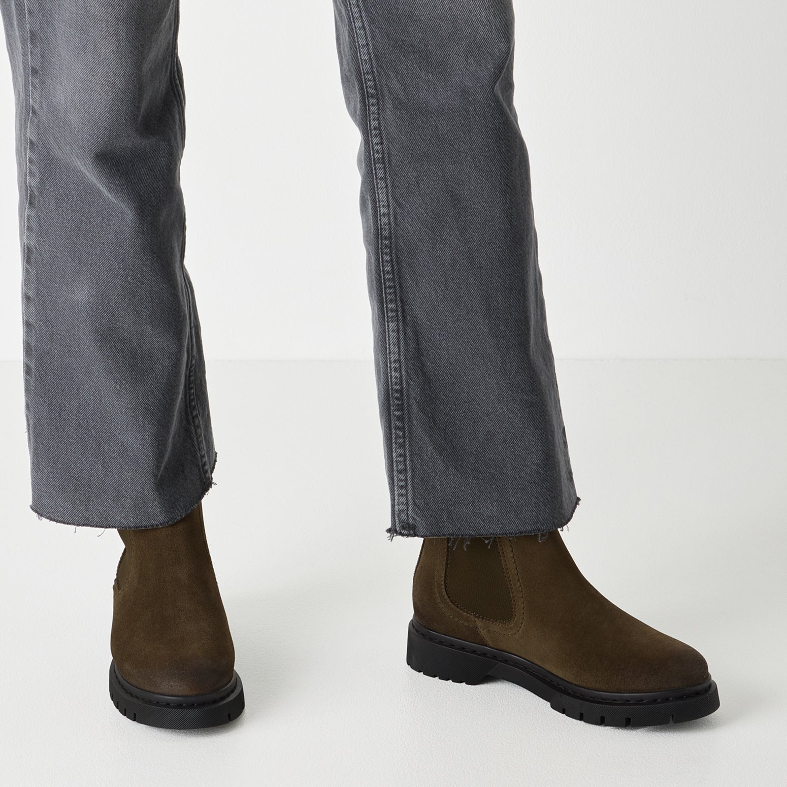 Tamaris women's olive suede pull-on ankle boots with chunky black soles and elastic side panels.