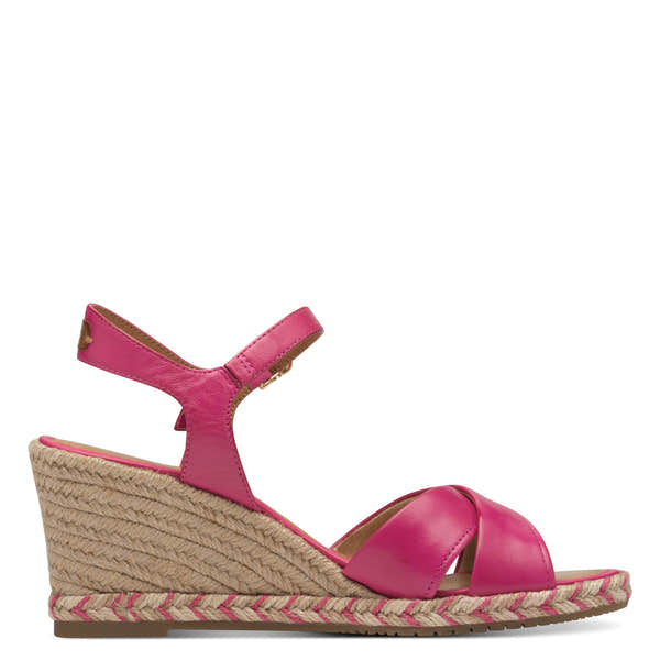 Pink leather wedge sandals with ankle strap and woven espadrille-style platform.
