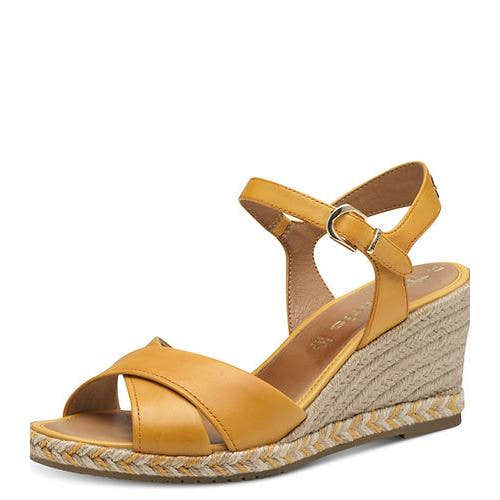 Tamaris 28346-44 women's yellow leather wedge sandals with ankle buckle strap and braided espadrille-style sole.