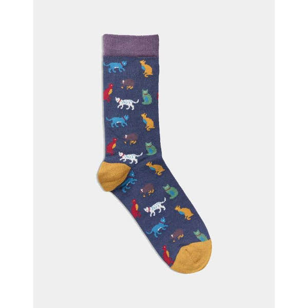 Women's navy socks with colorful cat and animal patterns, featuring purple top and mustard heel and toe accents.
