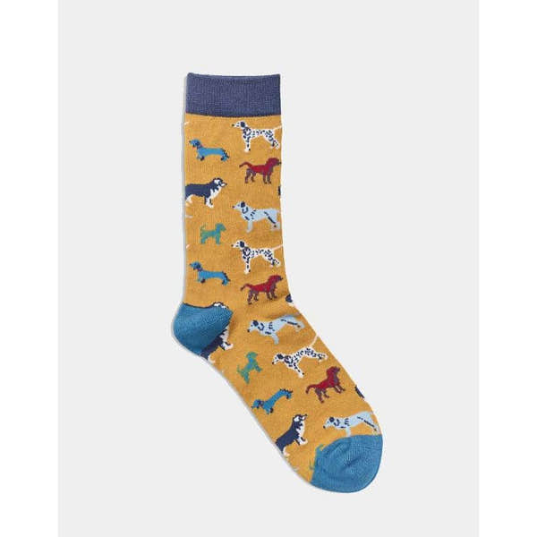 The Quintessential Ladies Socks - Dogs Mustard featuring colorful dog patterns, blue heel and toe, and mustard yellow background.