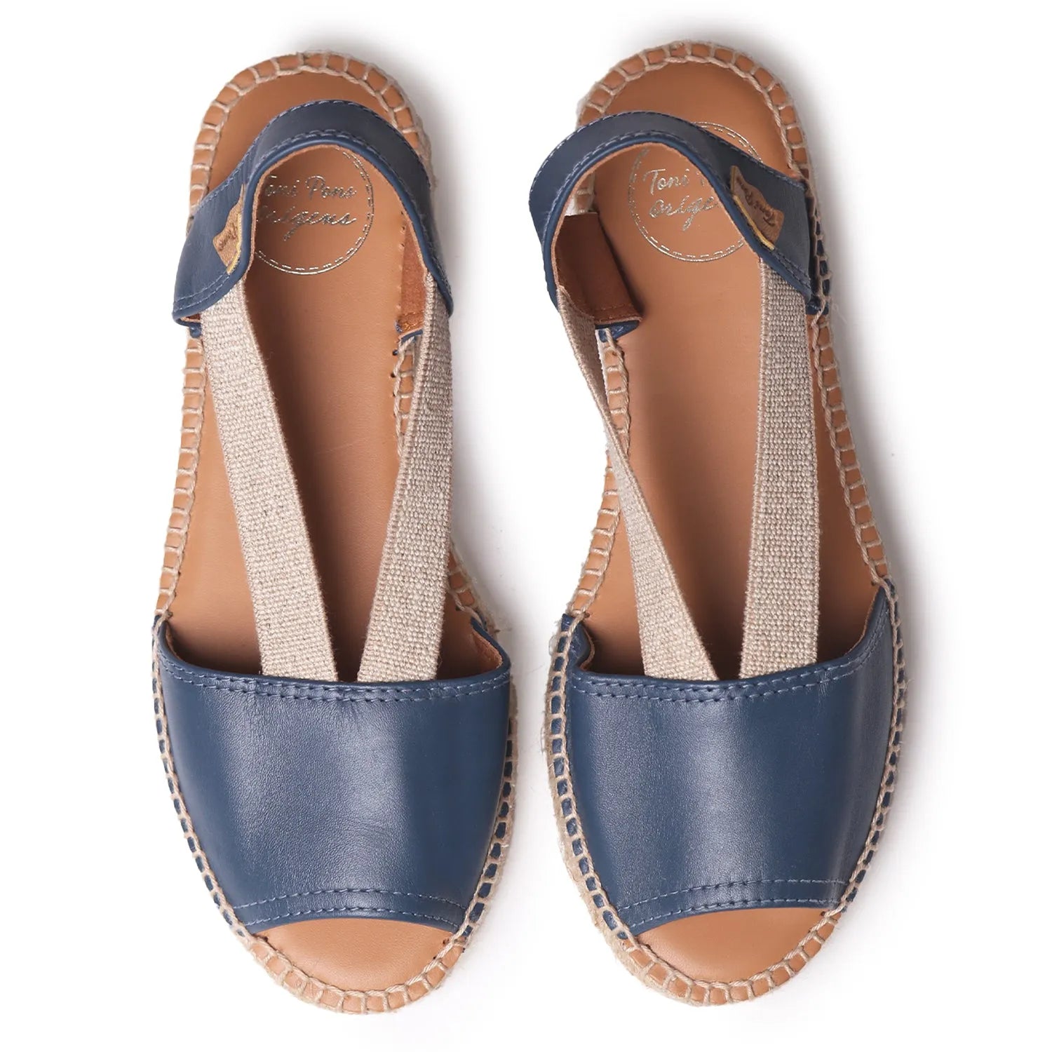 Toni Pons Etna women's navy leather elasticated sandals with beige fabric straps and stitched sole detail.