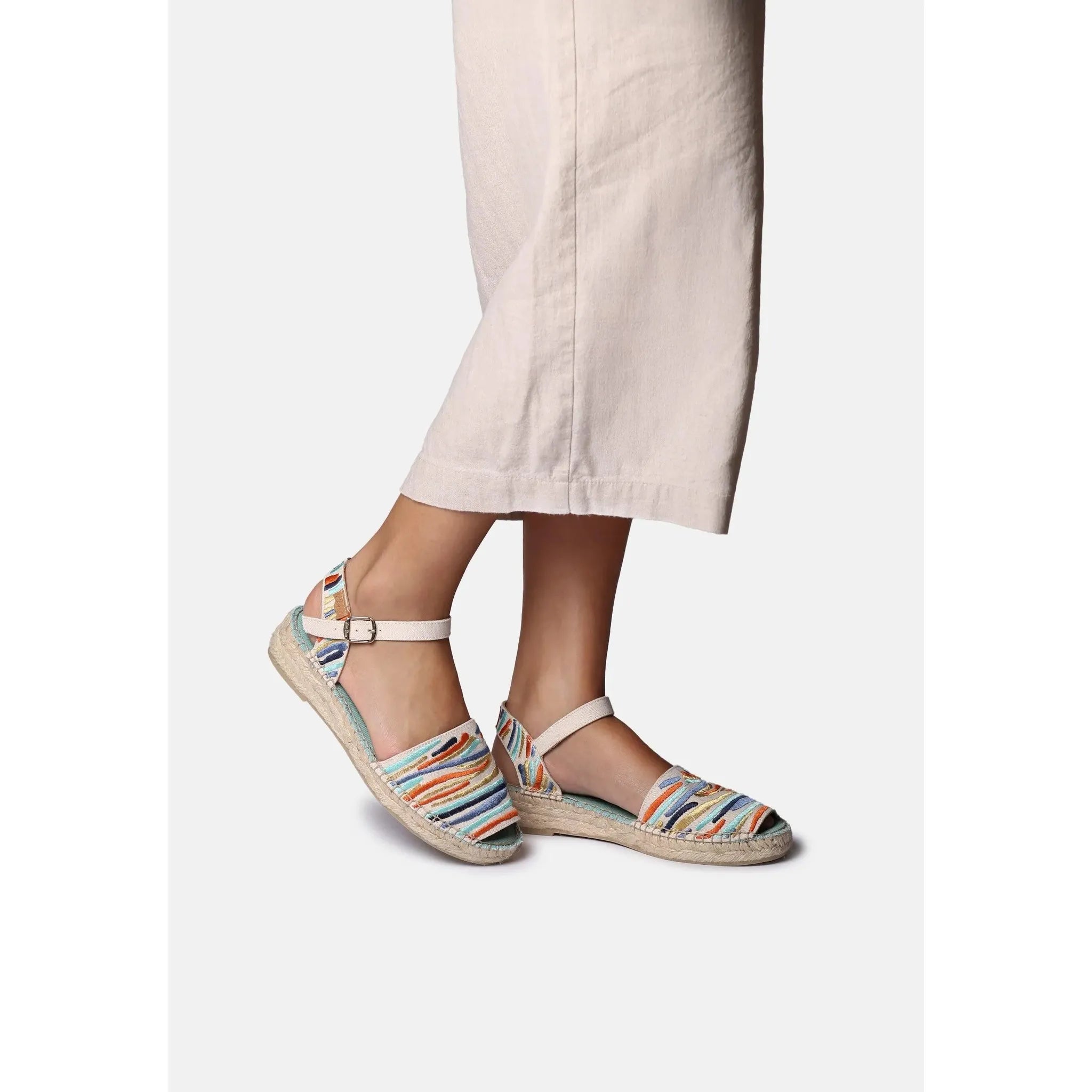 Toni Pons Garbet women's multi-textile buckle sandals featuring colorful striped fabric design and espadrille-inspired soles.