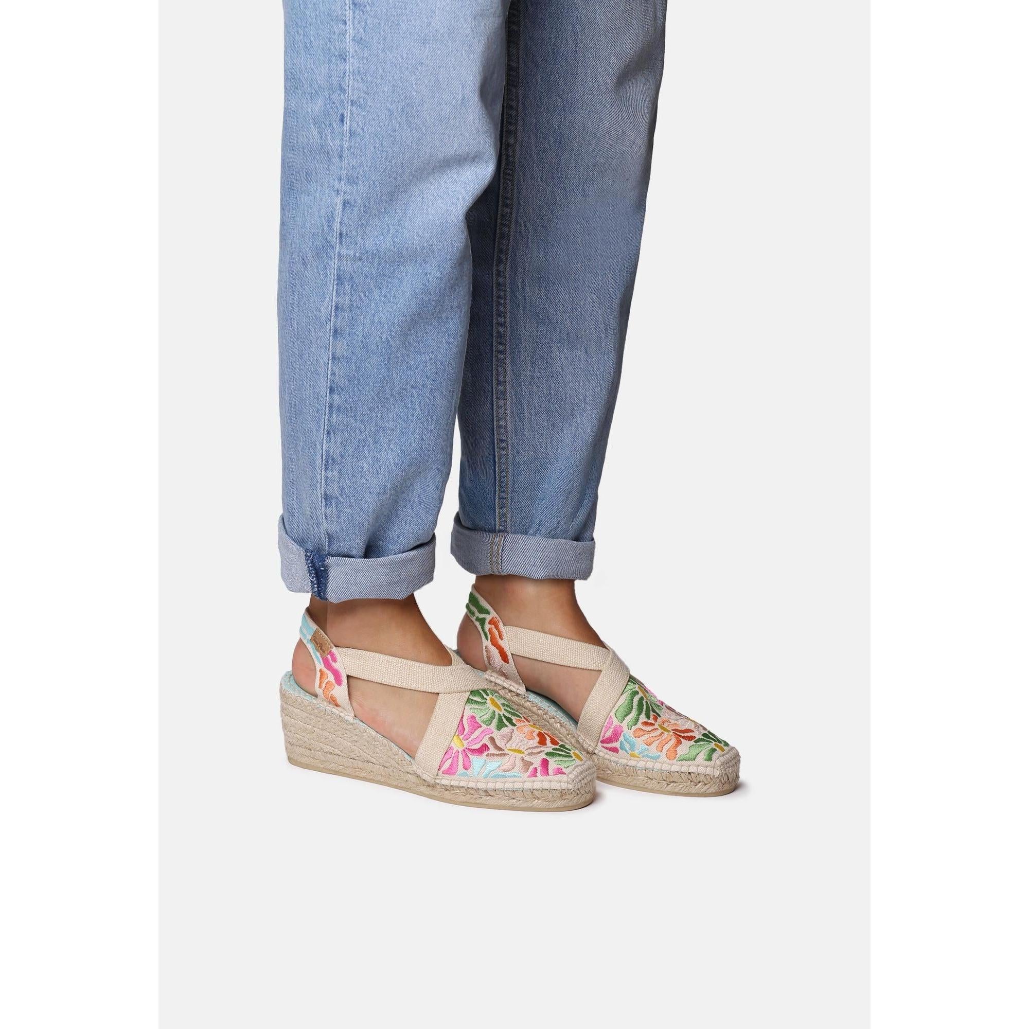 Toni Pons Montjoi women's Spanish mosaic textile wedge sandals with elastic straps and floral embroidery.