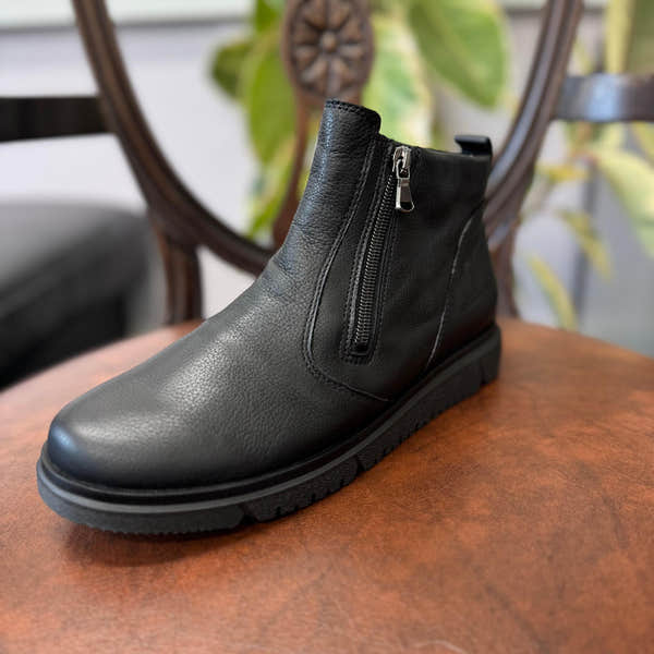 Waldlaufer women's black leather ankle boots with side zipper, wide fit, arch support, and durable sole.