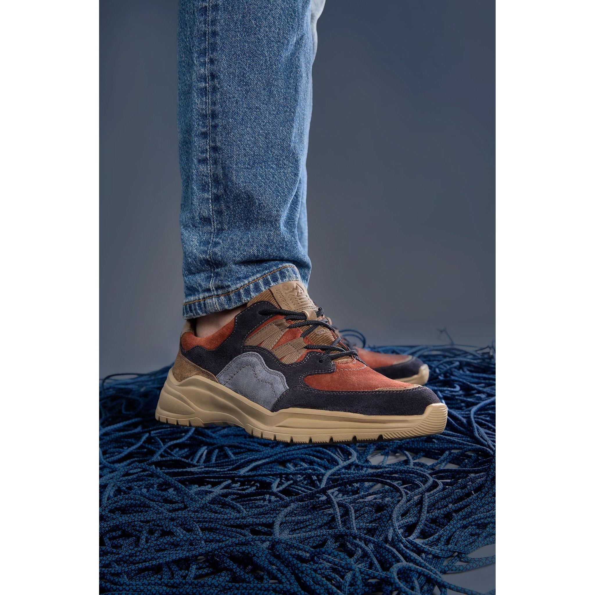 Women's multi suede hiking trainers with arch support, zip and lace fastening, shown on a person wearing jeans and outdoor shoes.