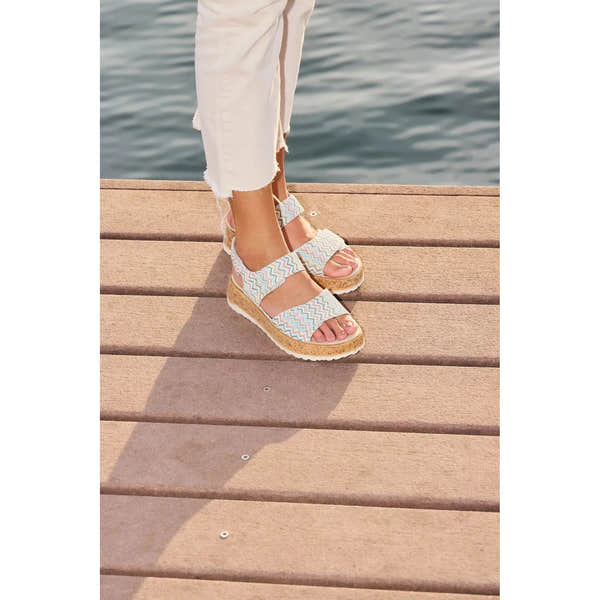 Waldlaufer H-Libby ladies' wide multi-leather touch fastening sandals with zigzag patterned straps, worn by a person near water.