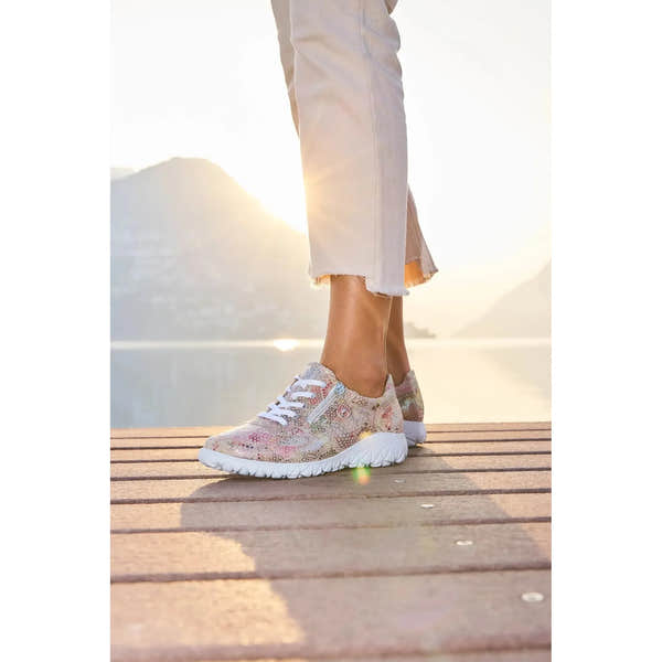 Waldlaufer H89001 ladies wide-fit multicolored nubuck trainers with zip and lace closures, worn by a person standing on a wooden dock at sunset.