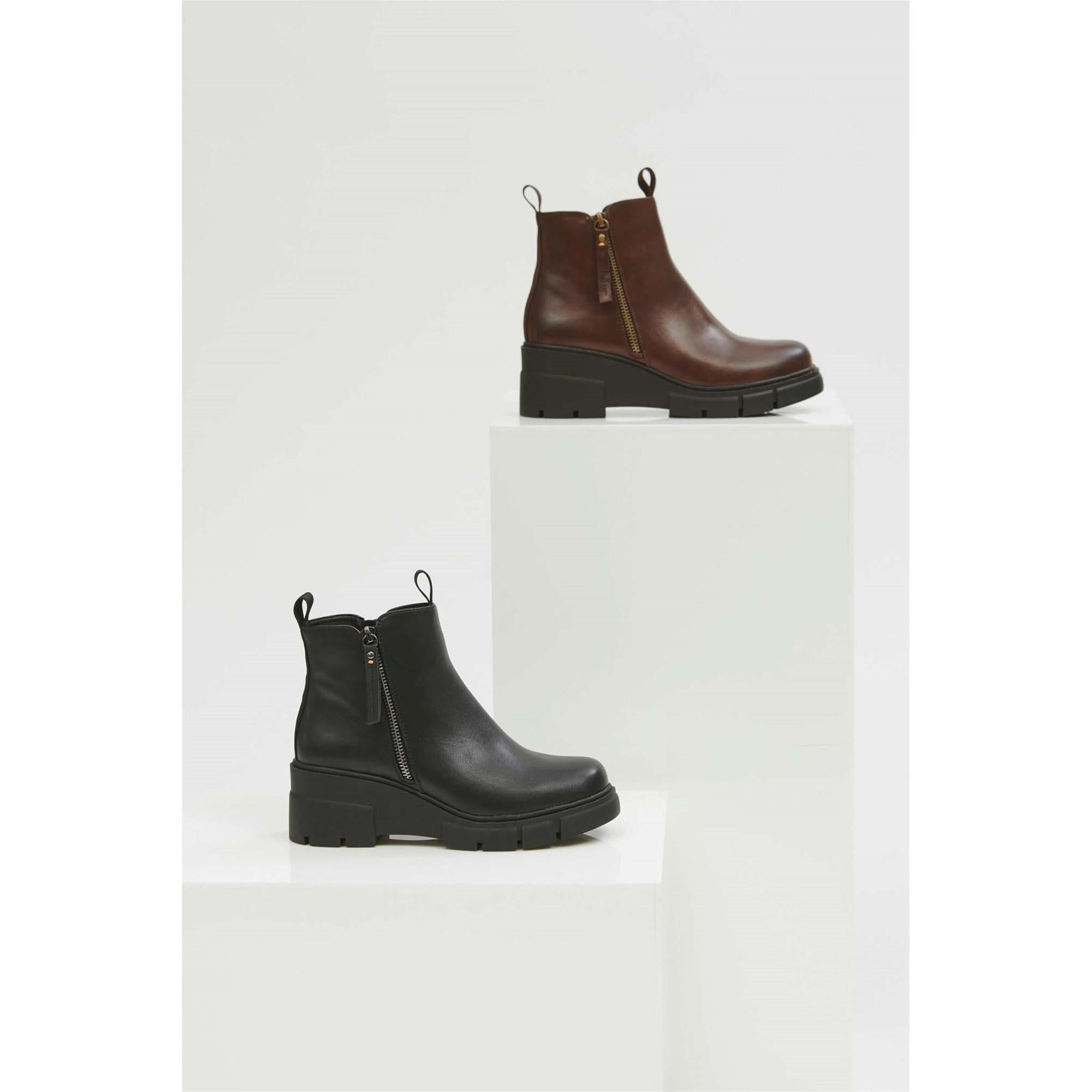 Women's black waterproof ankle boots with side Zips and chunky heels for stylish comfort.