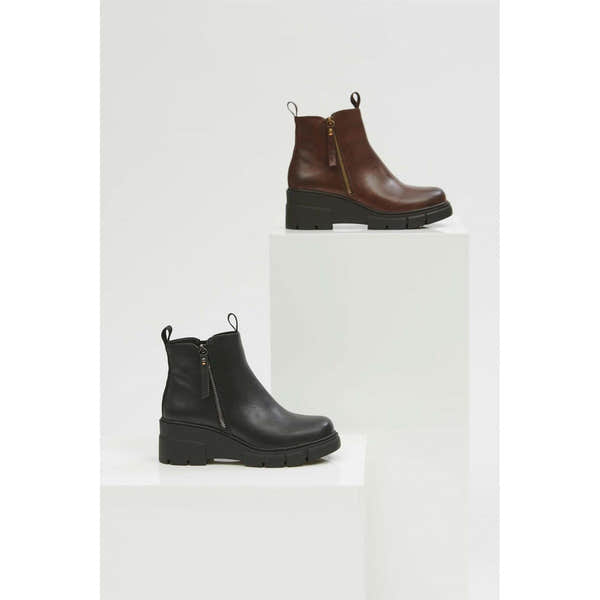 Women's black waterproof ankle boots with side Zips and chunky heels for stylish comfort.