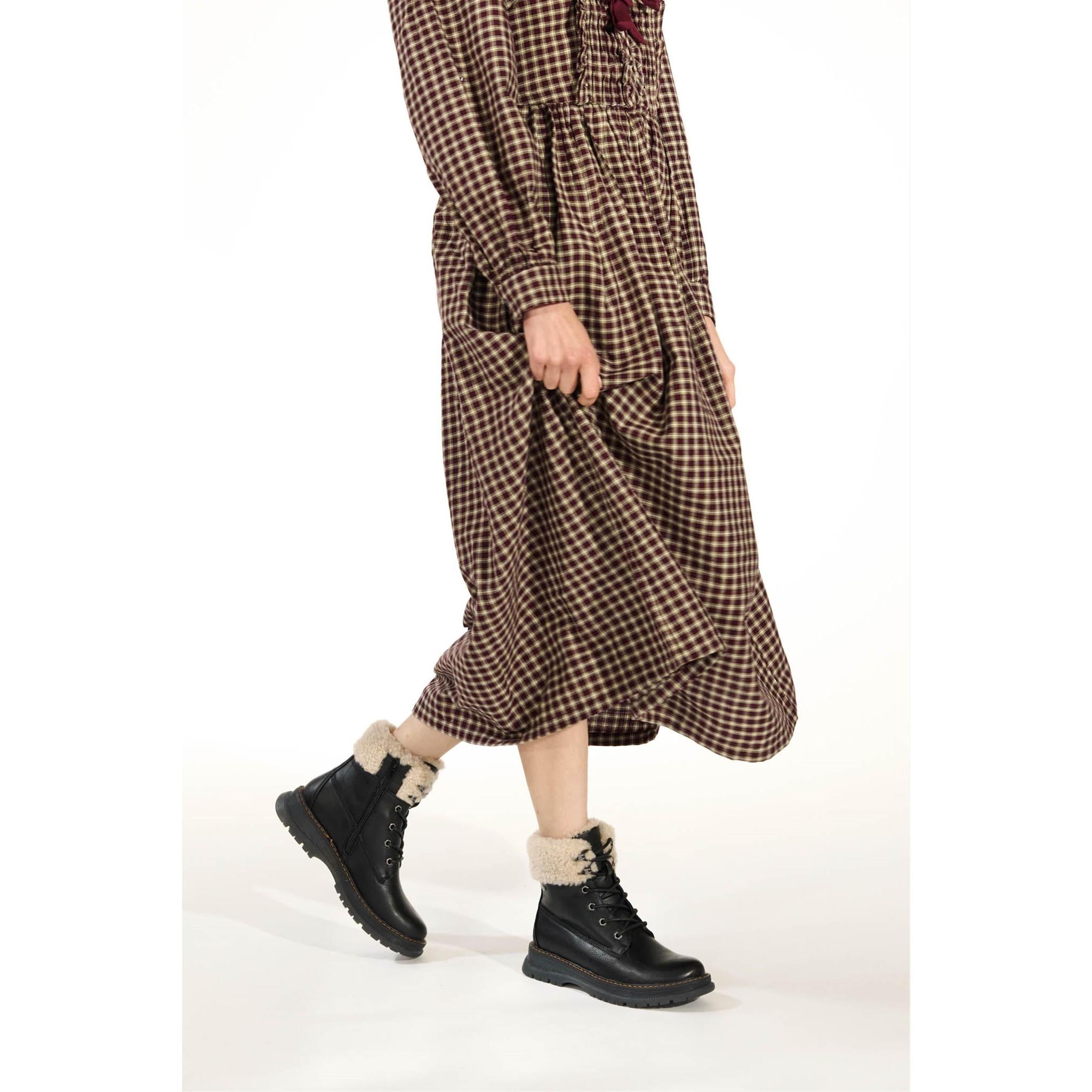Westland Peyton 16 women's black vegan waterproof zip-and-lace faux fur ankle boots worn on foot, Westland lifestyle view 9.