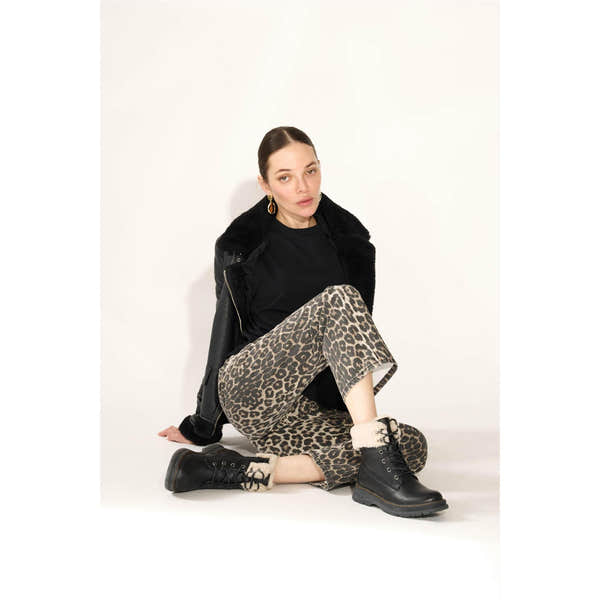 Westland Peyton 16 women's black vegan waterproof zip-and-lace faux fur ankle boots worn on foot, Westland lifestyle view 14.