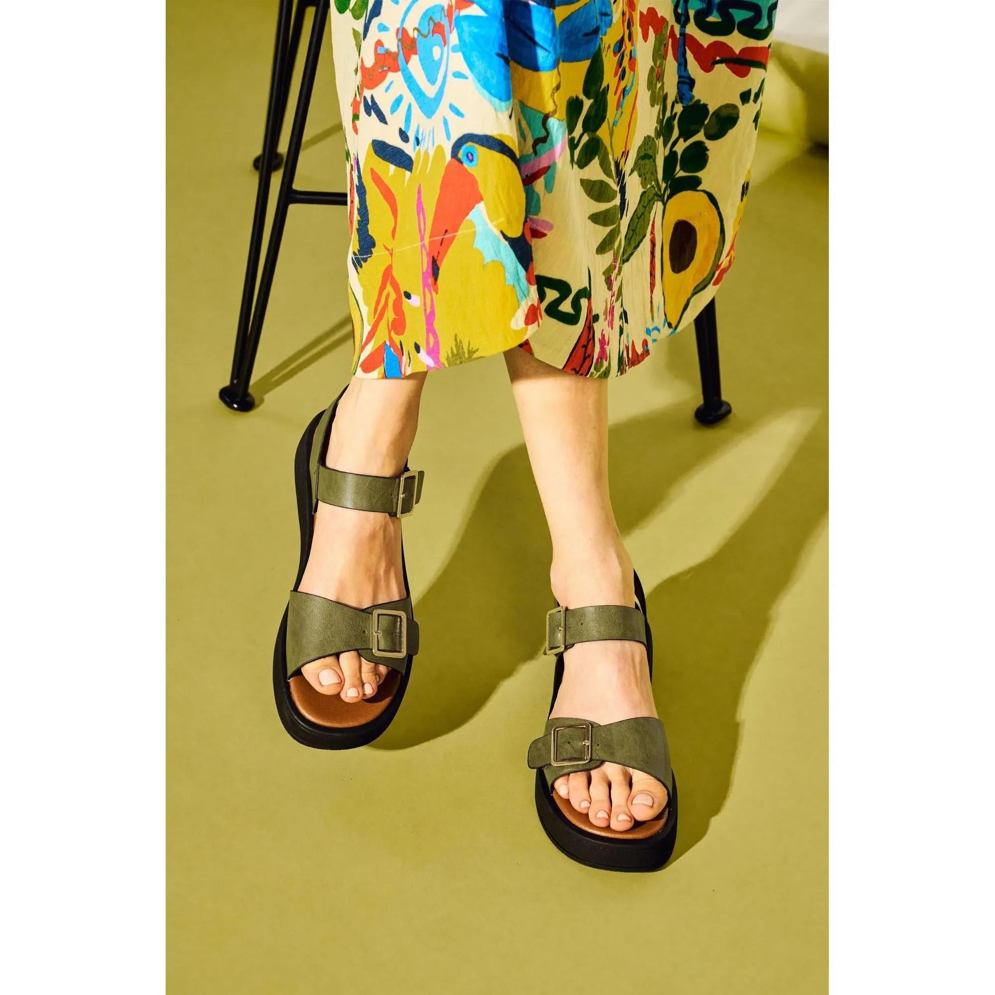 Westland Macie 03 ladies olive touch fastening sandals with black soles, worn with a colorful floral skirt.