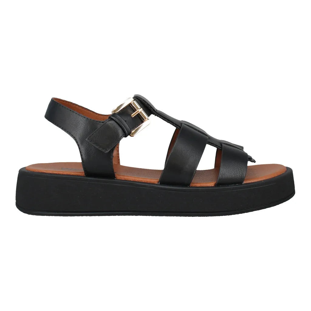Black leather slide sandals with touch-fastening straps, cushioned brown insole, thick black platform sole.
