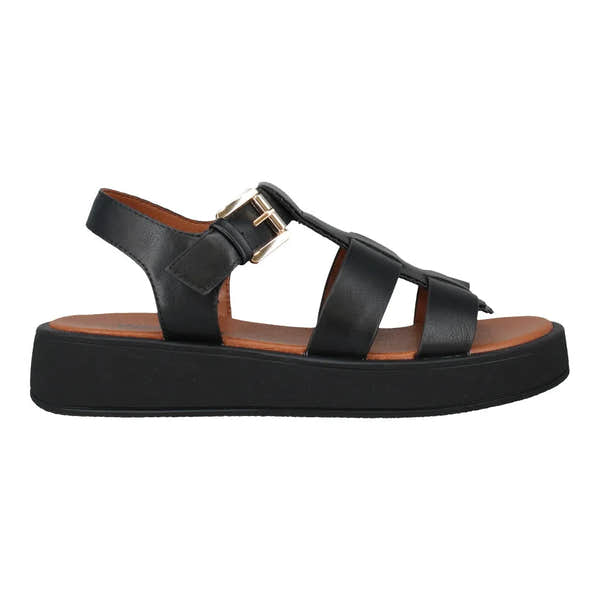 Black leather slide sandals with touch-fastening straps, cushioned brown insole, thick black platform sole.