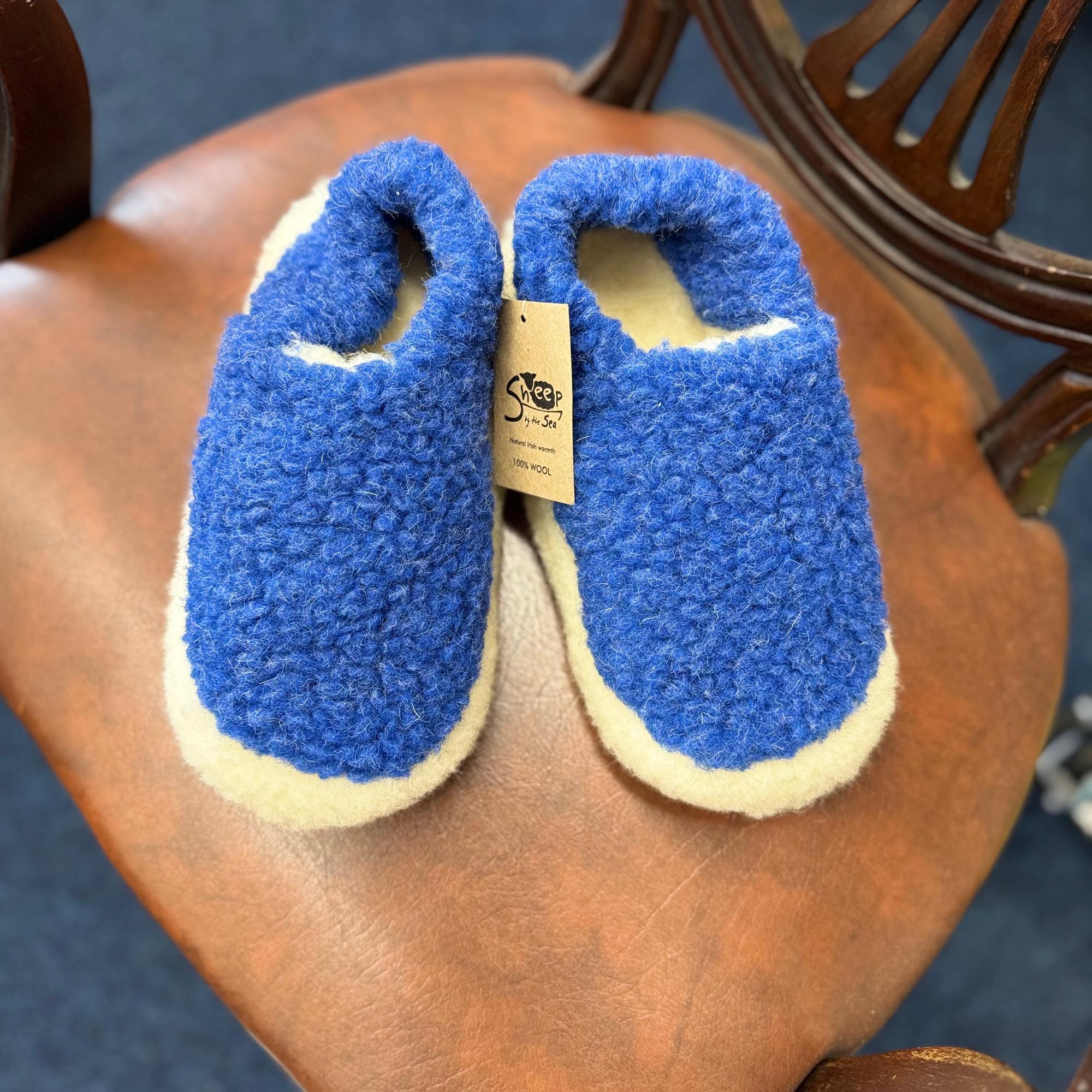 Unisex deep blue wool slippers with cream lining, cozy and warm, designed for comfort and indoor wear.