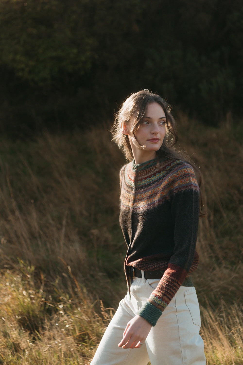 Eribé Alpine Cardigan in Oakley, model wearing the knit outdoors