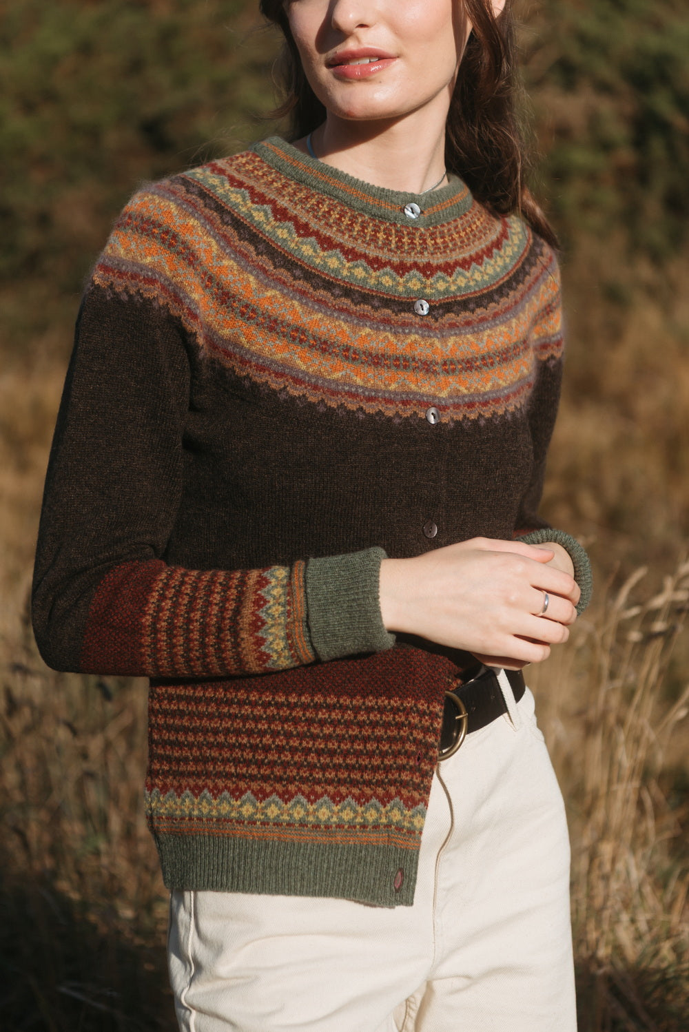 Eribé Alpine Cardigan in Oakley, close-up of the Fair Isle yoke, buttons and patterned cuff
