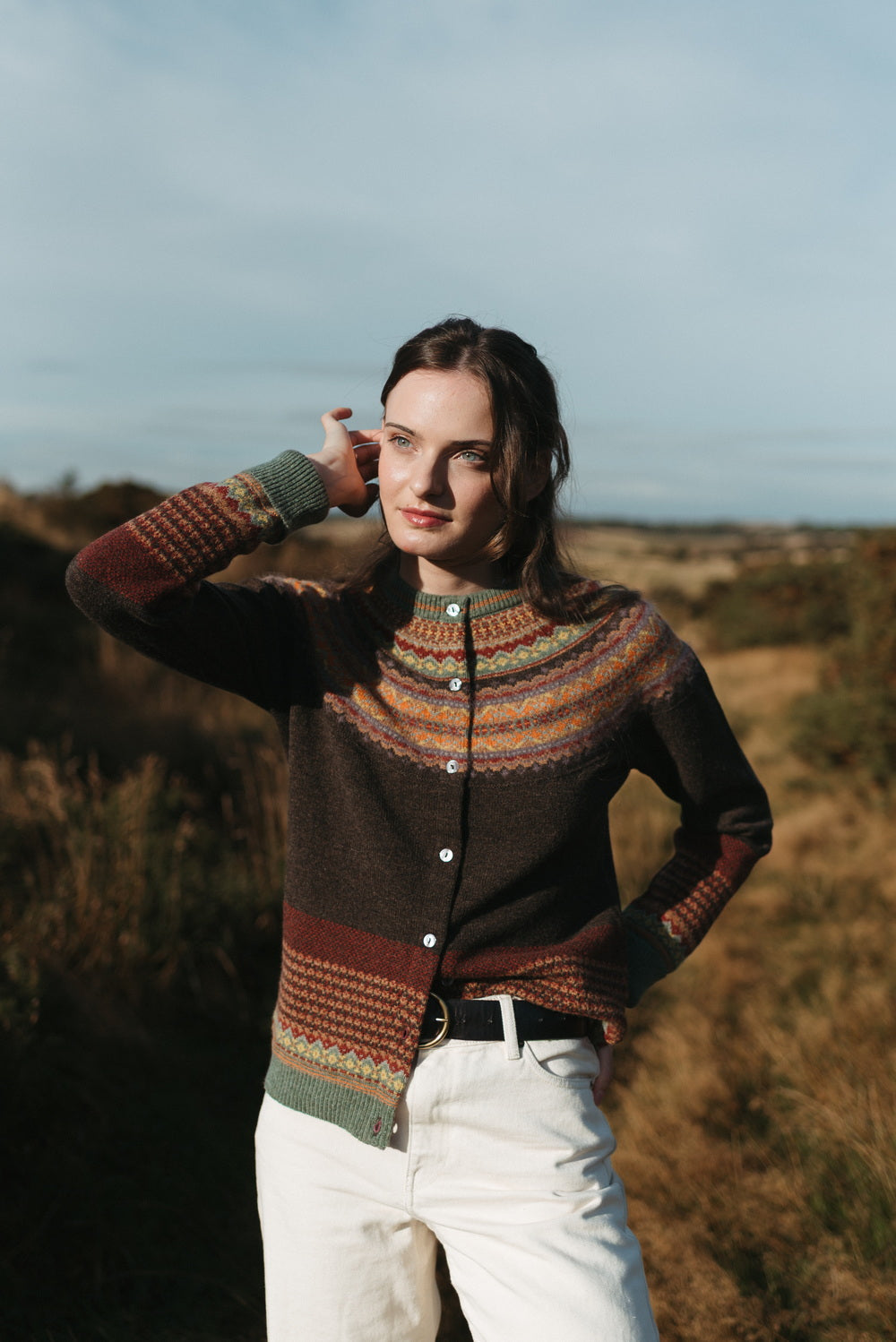 Eribé Alpine Cardigan in Oakley, front view of the buttoned cardigan worn outdoors
