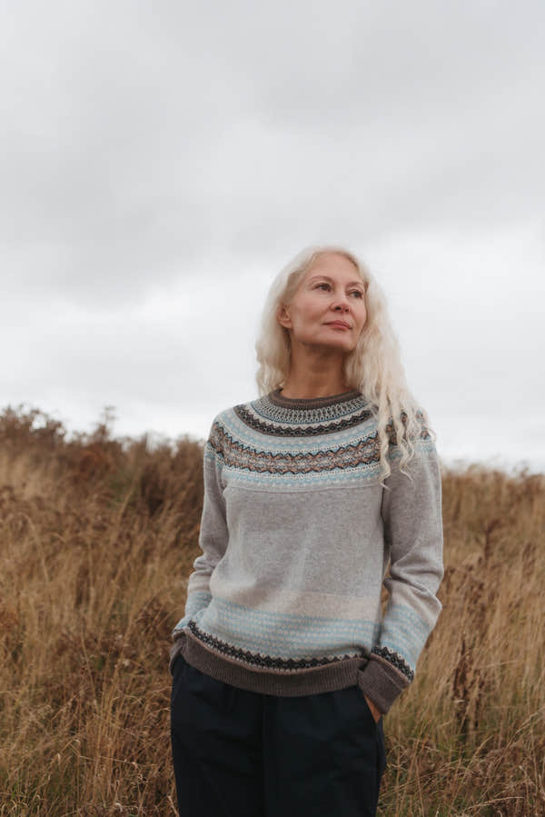 Eribé Alpine Sweater in Grace, model wearing the knit outdoors
