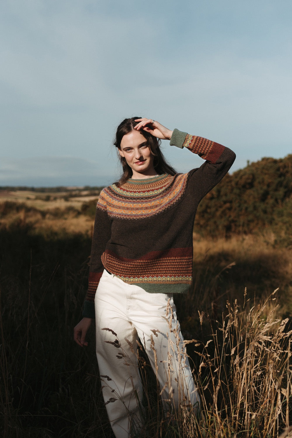 Eribé Alpine Sweater in Oakley, model wearing the knit outdoors