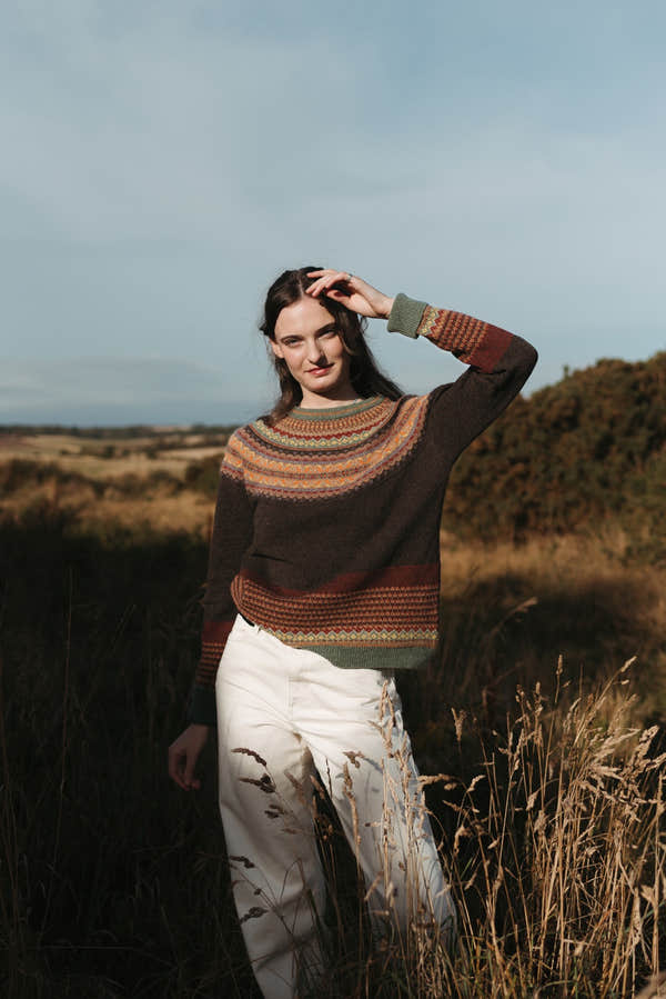 Eribé Alpine Sweater in Oakley, model wearing the knit outdoors