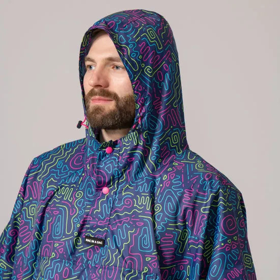 Unisex neon festival poncho with a colorful abstract pattern, hood, and adjustable drawstrings, ideal for outdoor events.