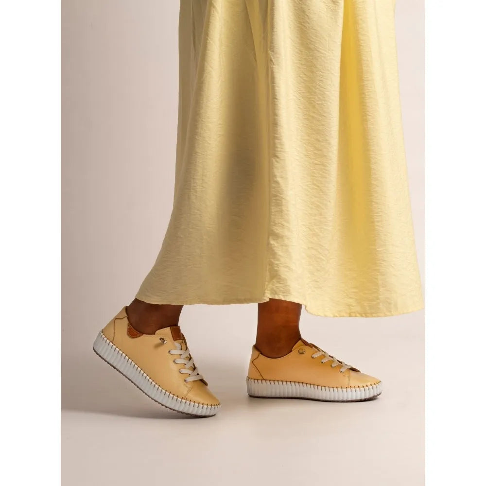 Lunar FLE057 Faith Ladies Lemon Leather Lace-Up Shoes with white sole, casual sneaker style, worn with a yellow maxi dress.