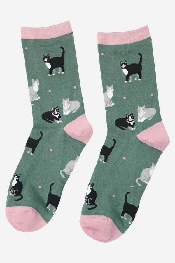 Sock Talk black cat and gray cat ankle socks with pink accents, featuring a playful cat print on green background.