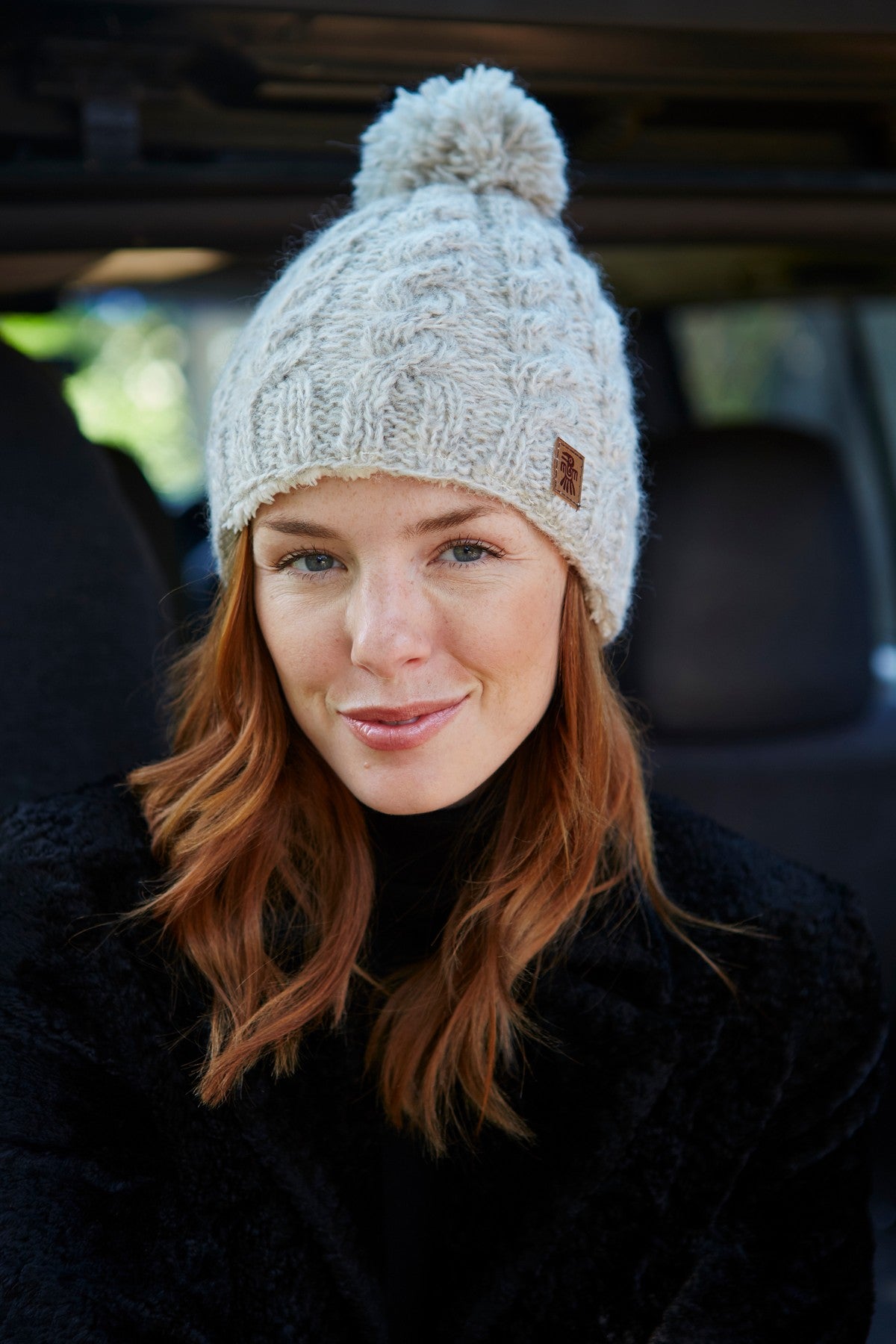 Pachamama Cairngorm Bobble Beanie Oatmeal, with a softly textured cable knit; product view 3.