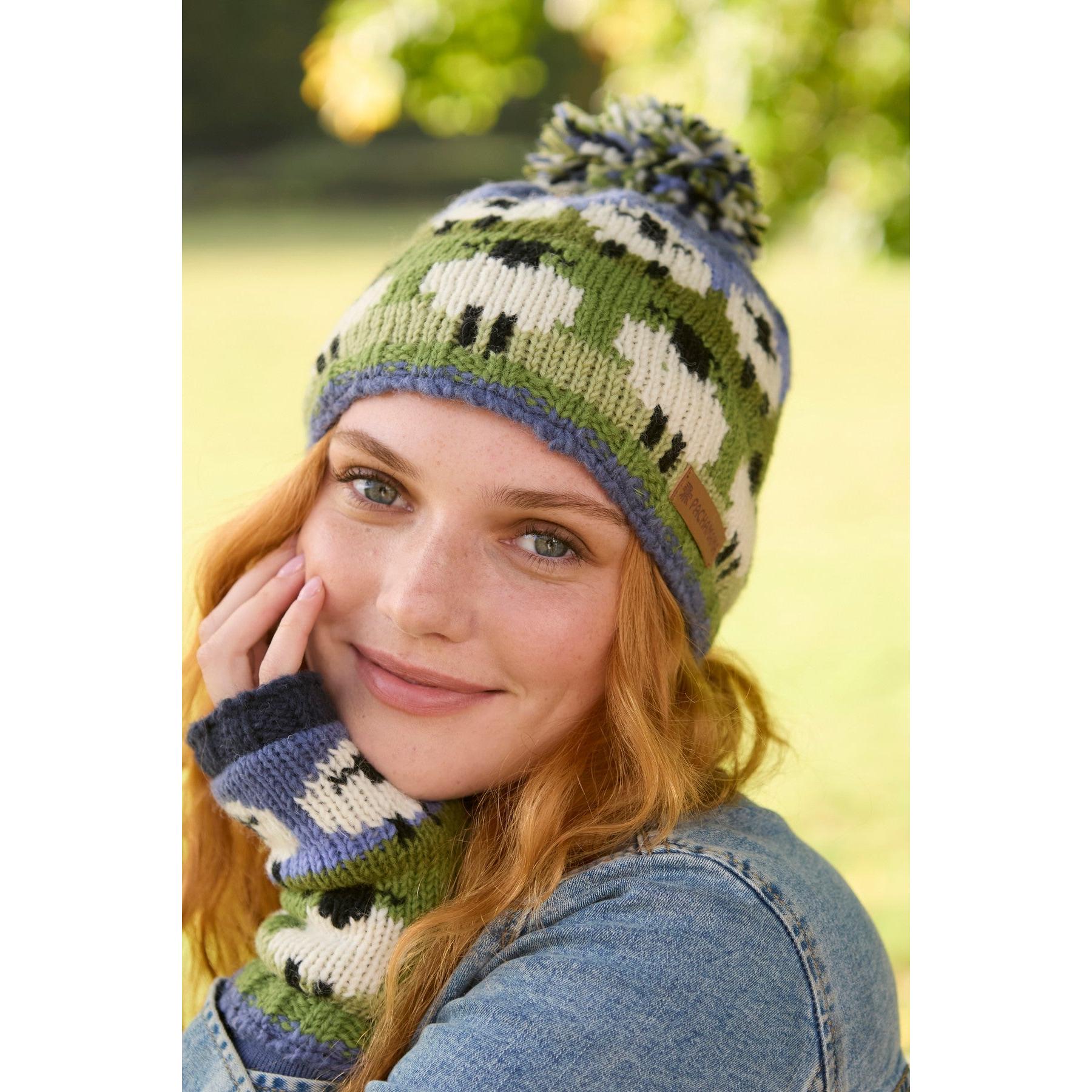 Pachamama Flock Of Sheep Bobble Beanie, with rows of sheep; product view.