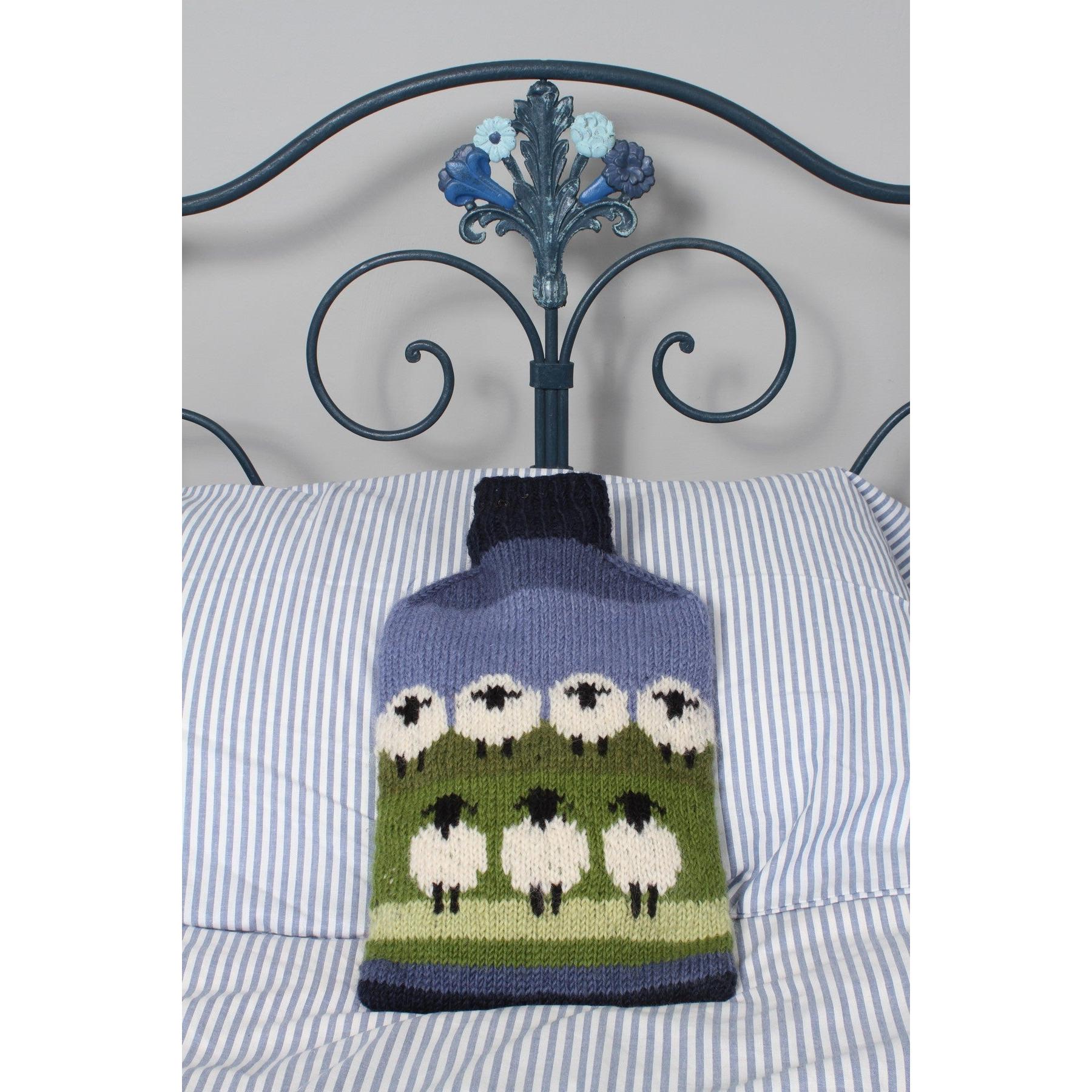 Pachamama Flock Of Sheep Hot Water Bottle, with rows of sheep; product view.