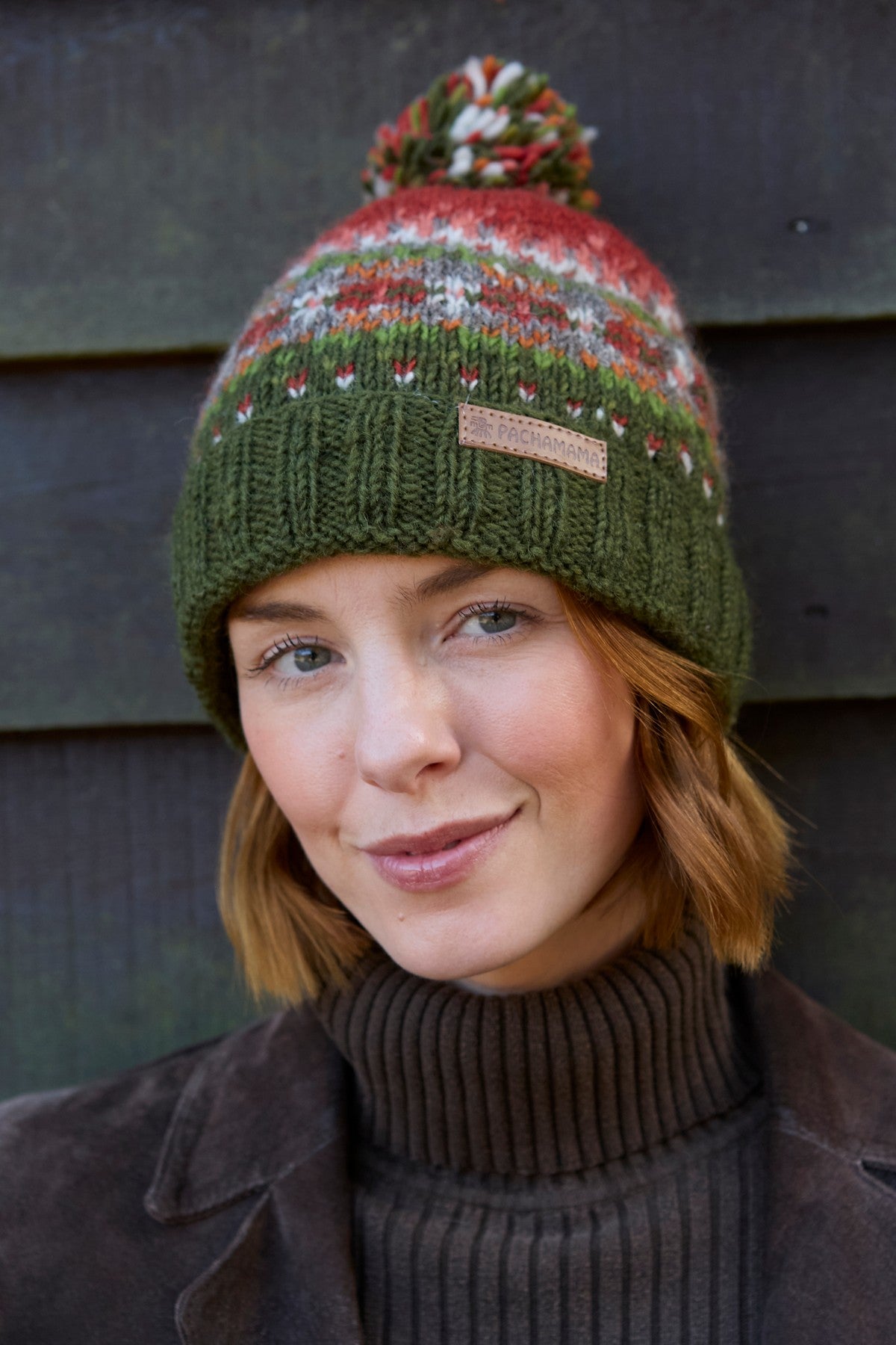 Pachamama Iona Roll Back Bobble Beanie Moss, with colourful Fair Isle patterning; product view.