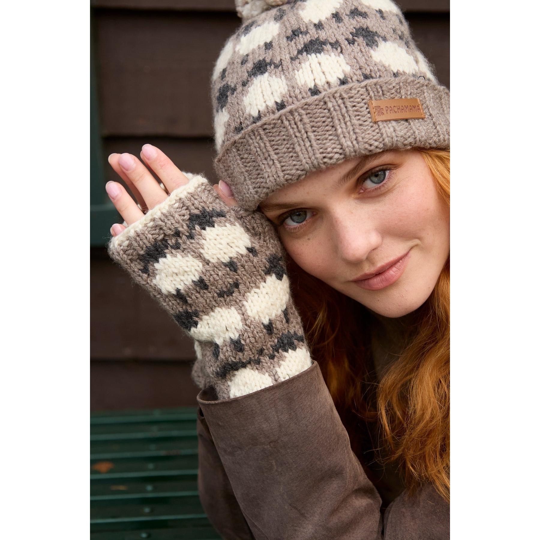 Pachamama Sheep (Merino) Handwarmers Mushroom, with contrasting sheep motifs; product view.